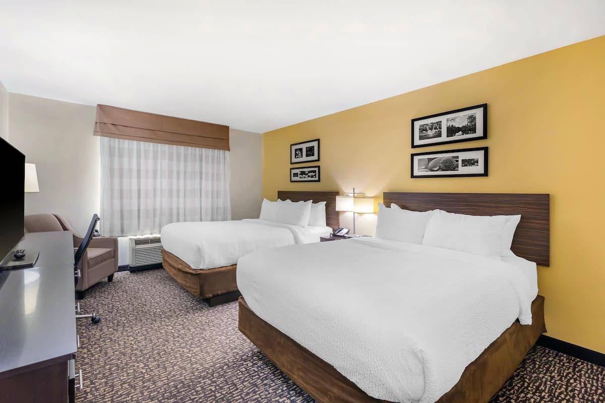 Pillowtop beds, desk, blackout drapes, iron/ironing board