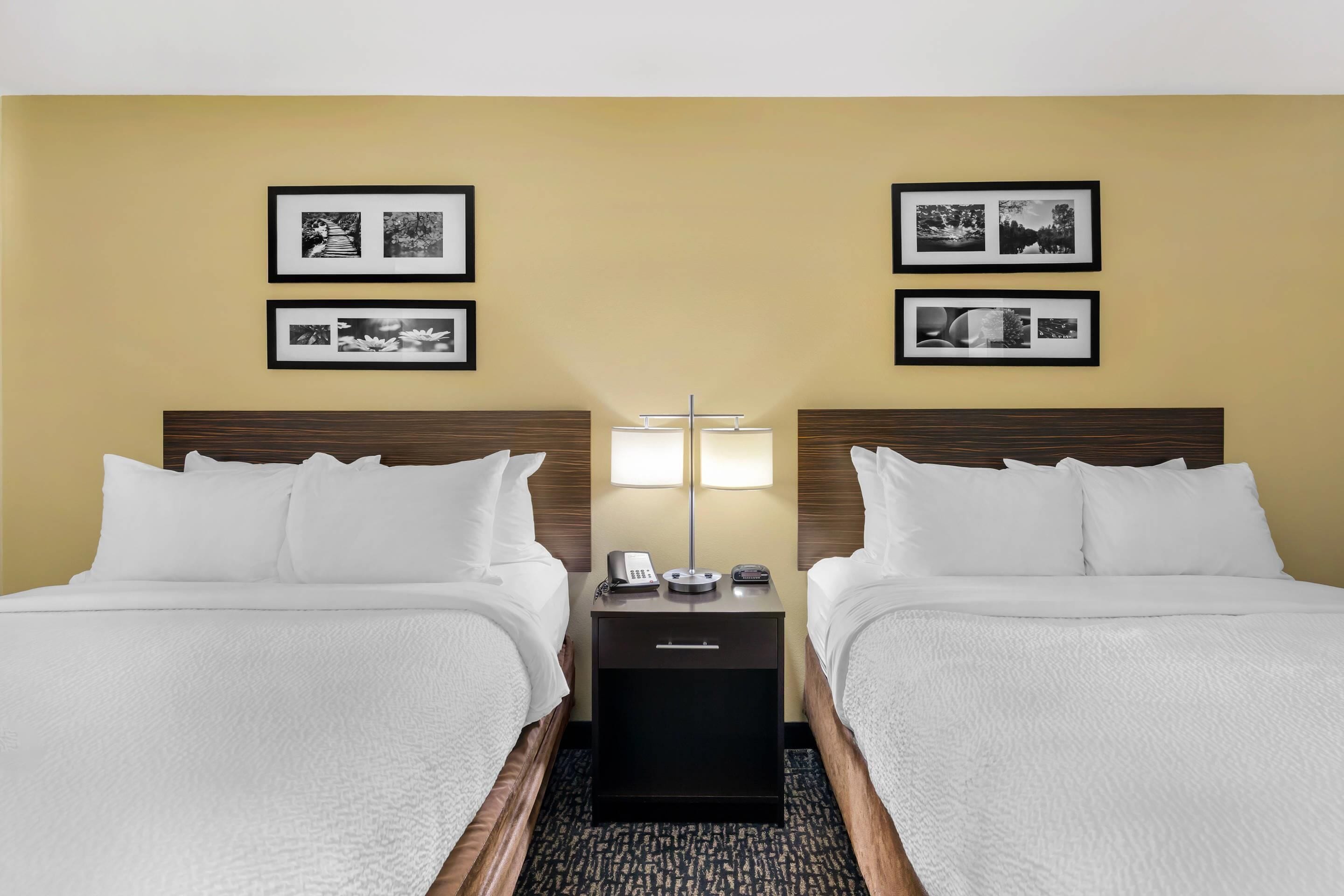 pillow-top beds, desk, blackout curtains, iron/ironing board