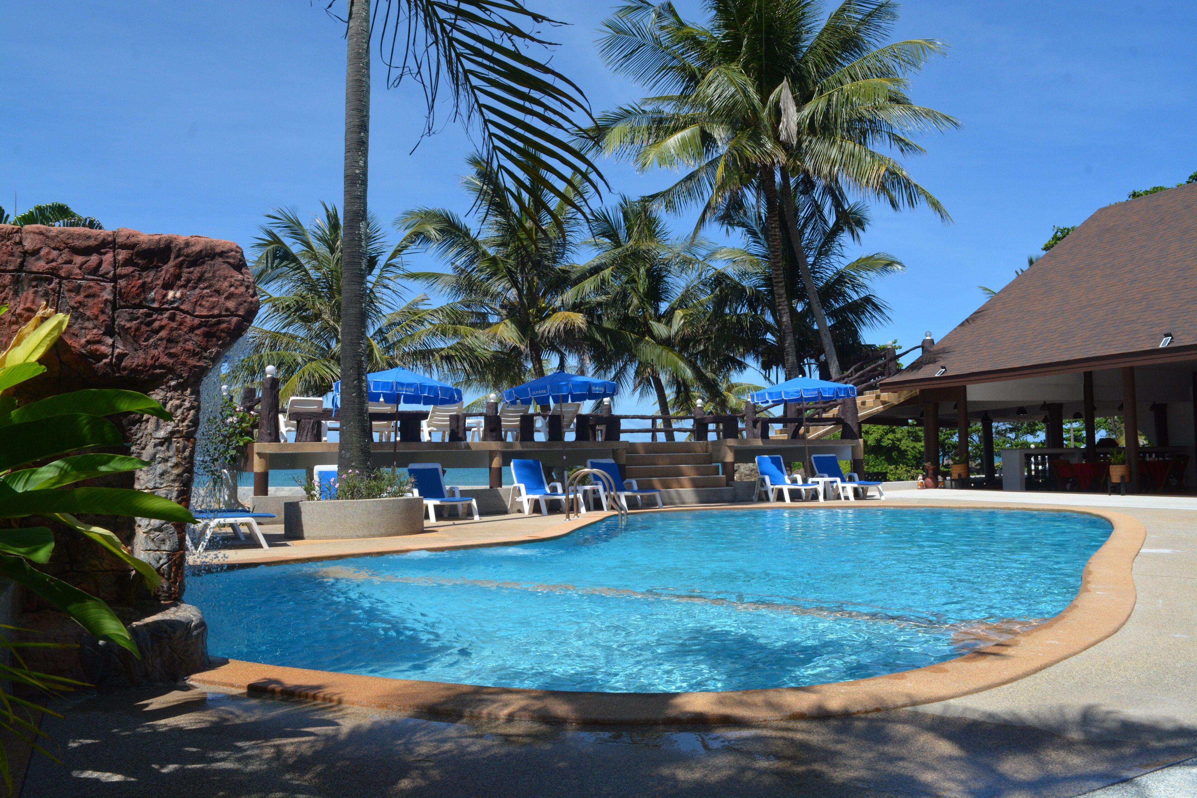 outdoor pool, open 8:00 am to 6:00 pm, pool umbrellas, pool loungers