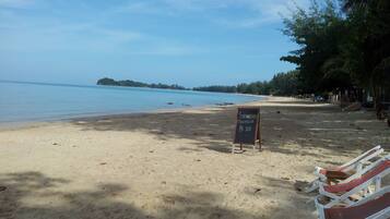 On the beach, sun-loungers, beach umbrellas, beach towels