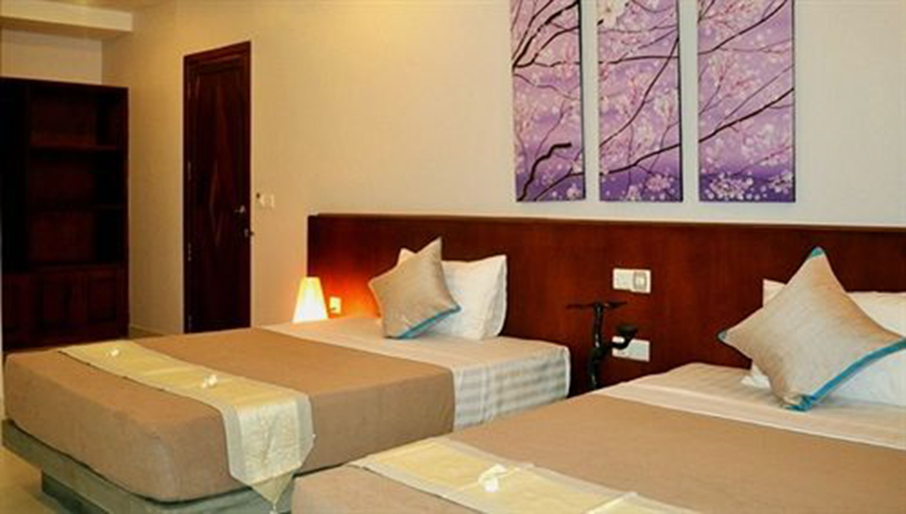 superior twin room | in-room safe, individually decorated, desk, blackout curtains