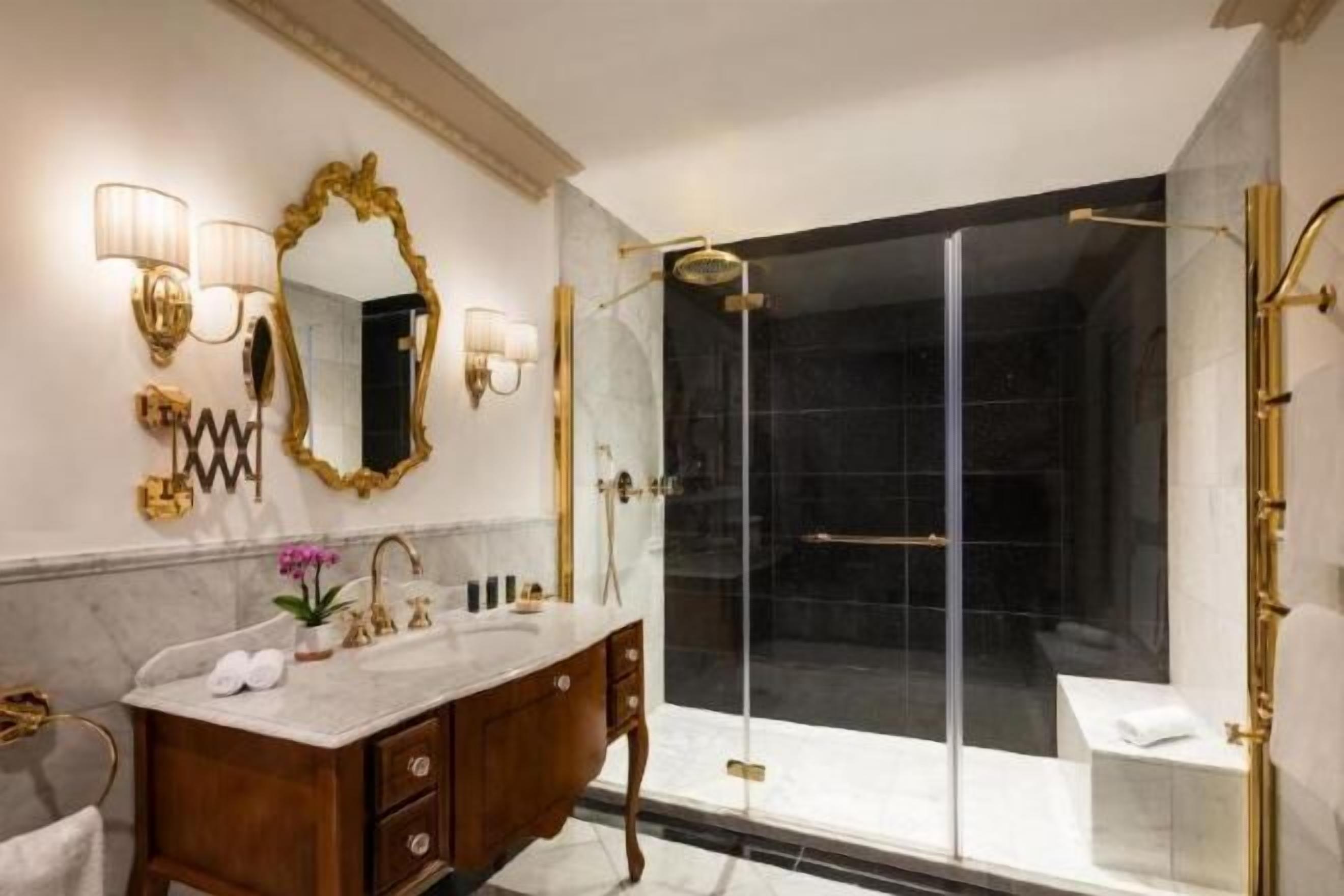 Designer toiletries, hair dryer, bathrobes, slippers