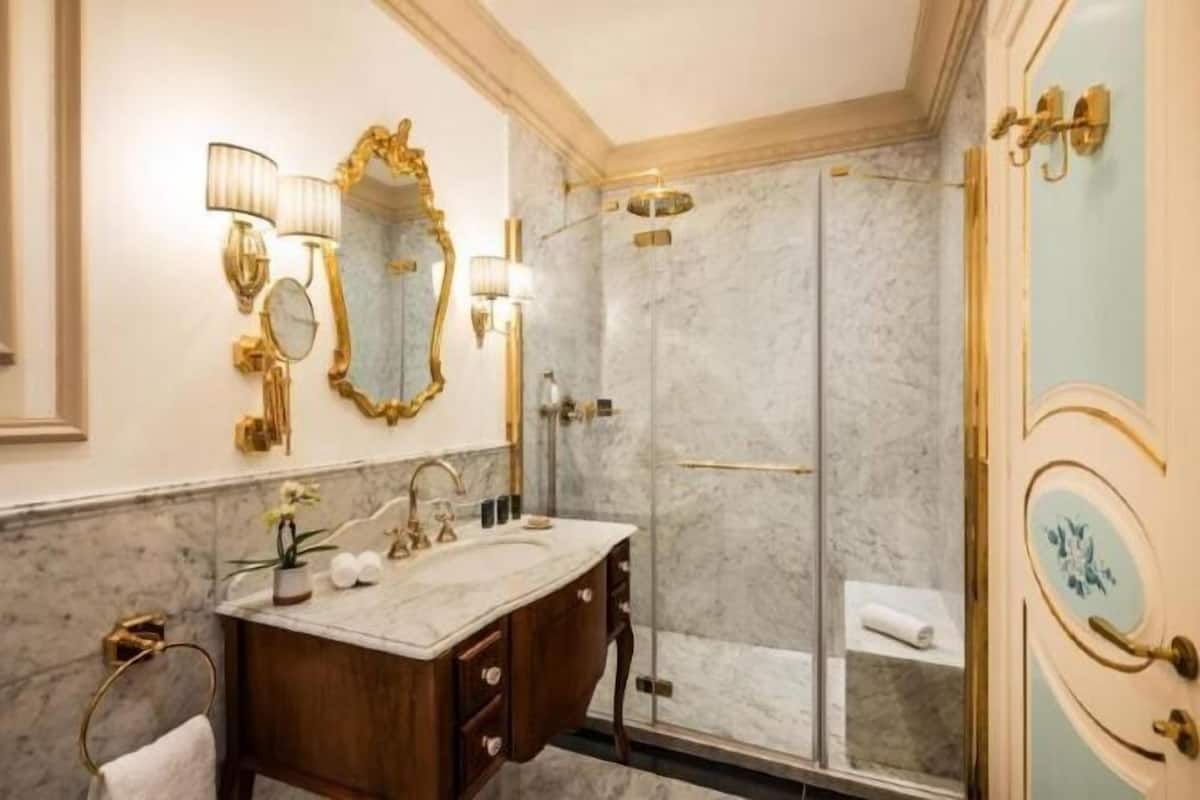 Bathroom | Designer toiletries, hair dryer, bathrobes, slippers