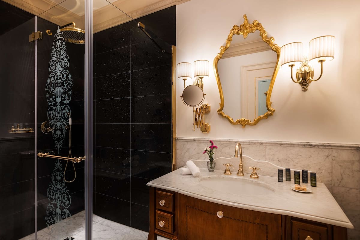 designer toiletries, hair dryer, bathrobes, slippers