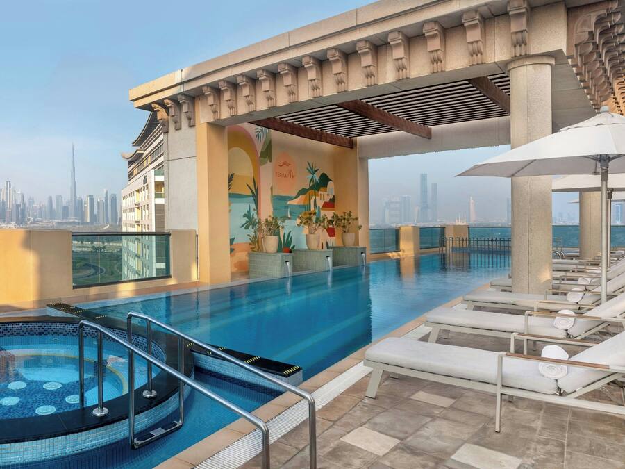 Outdoor pool, open 7:00 AM to 9:00 PM, pool umbrellas, sun loungers