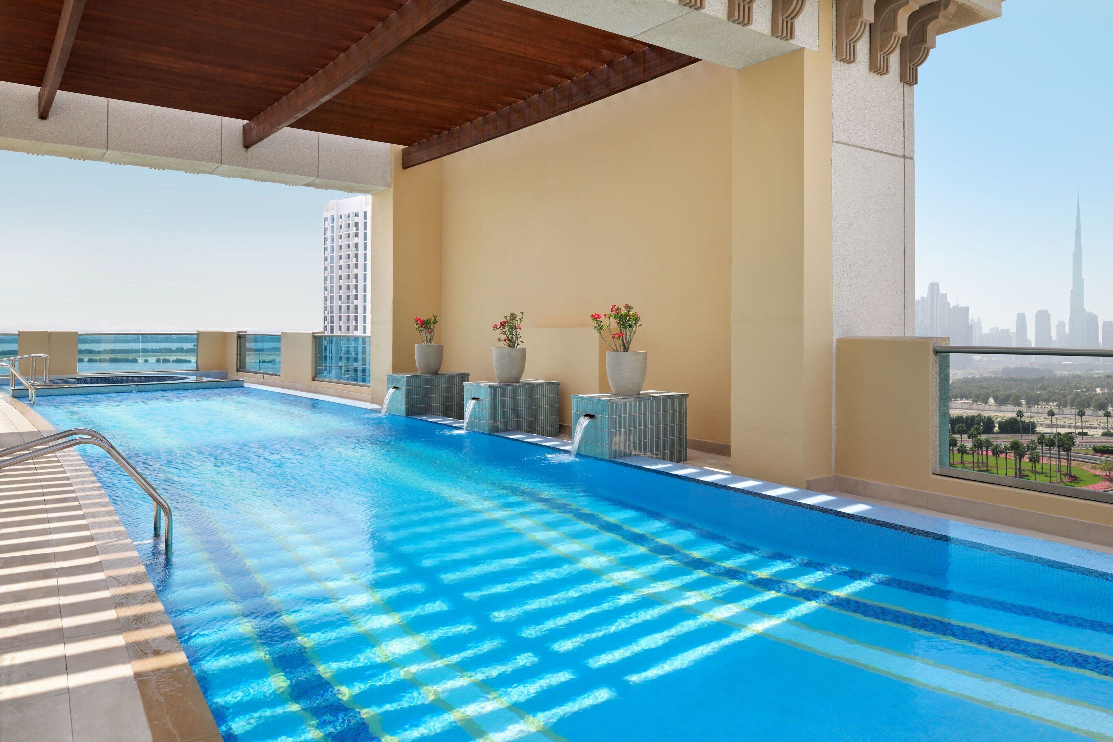 outdoor pool, open 7:00 am to 9:00 pm, pool umbrellas, pool loungers
