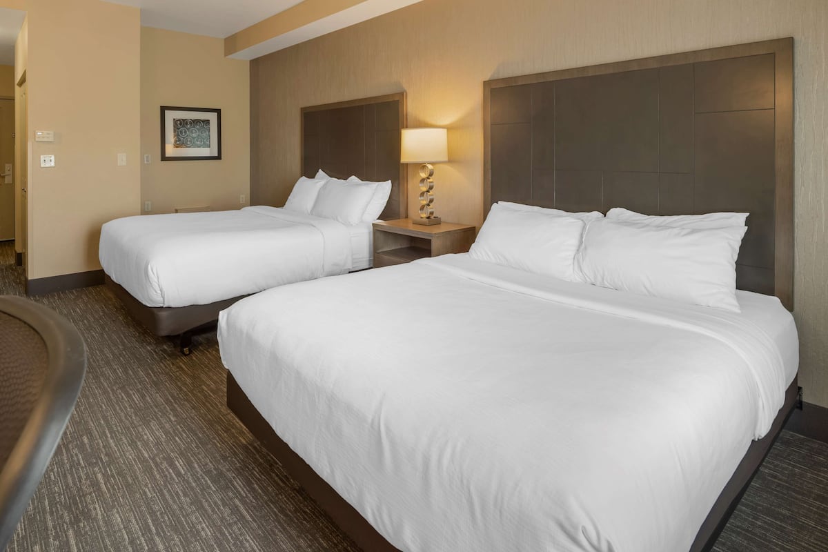 pillow-top beds, desk, laptop workspace, blackout curtains