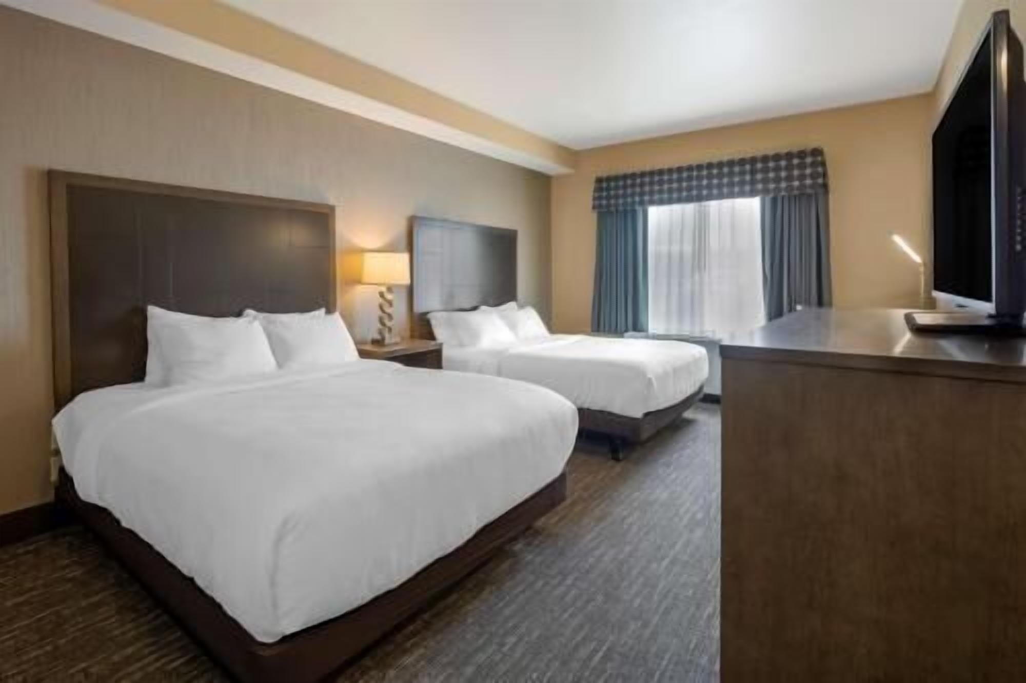 Pillow-top beds, desk, laptop workspace, blackout curtains