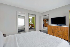Suite, 1 Queen Bed, Non Smoking | Desk, laptop workspace, blackout drapes, iron/ironing board