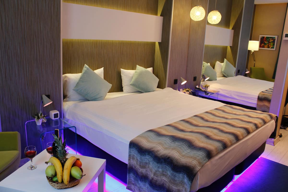 Premium bedding, minibar (some free items), in-room safe, desk