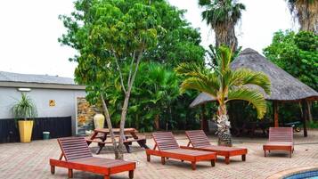 Outdoor pool, pool umbrellas, sun loungers