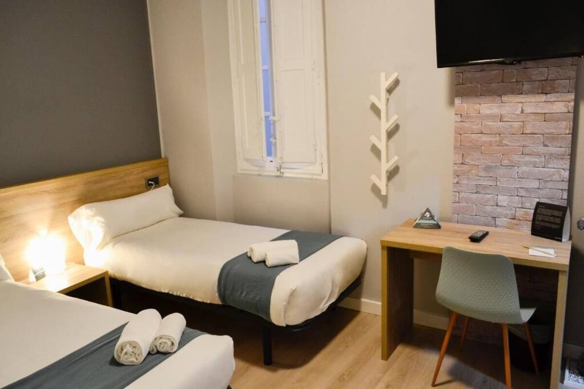 Desk, iron/ironing board (on request), WiFi (free), bed sheets
