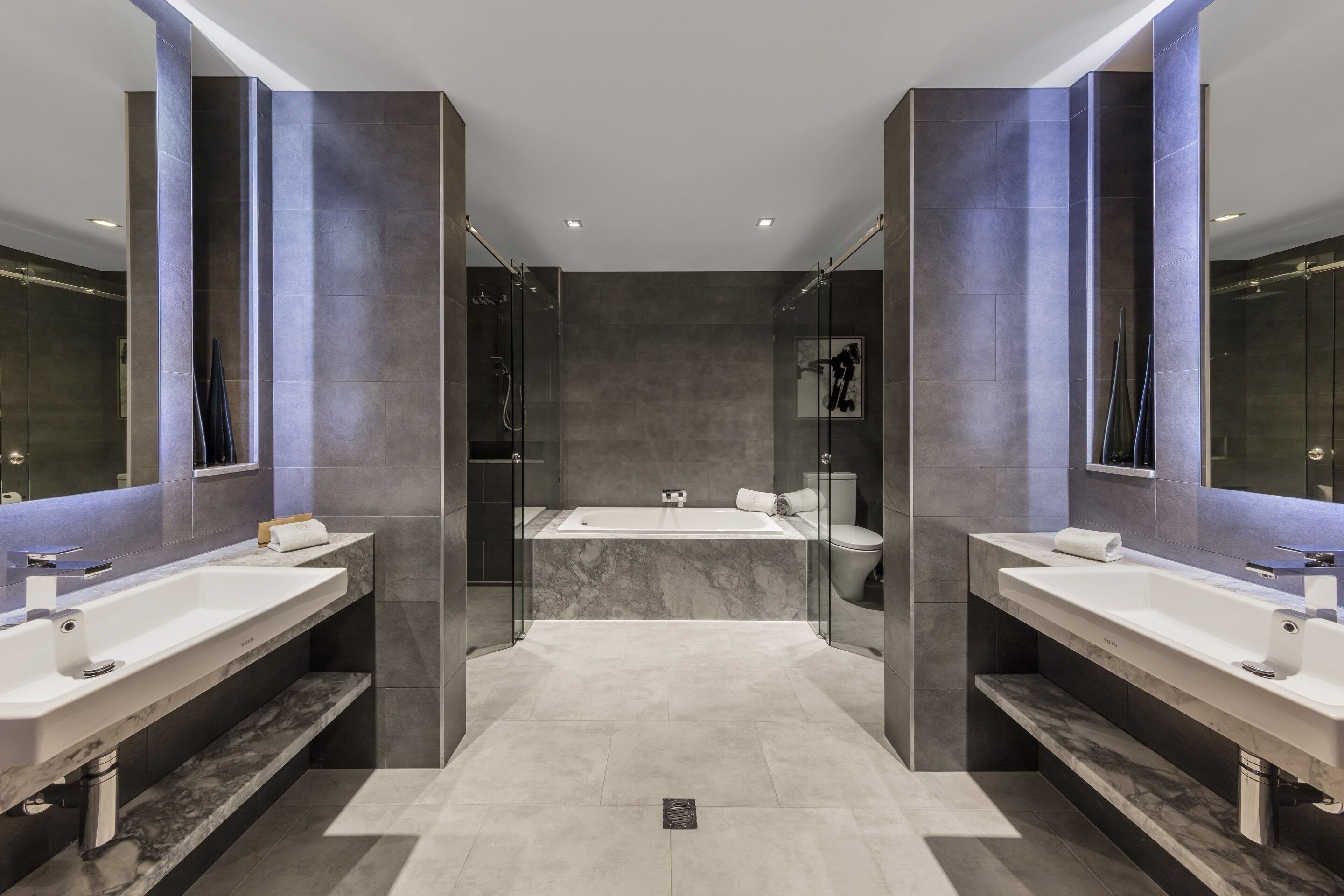 jg suite | bathroom | designer toiletries, hair dryer, bathrobes, slippers