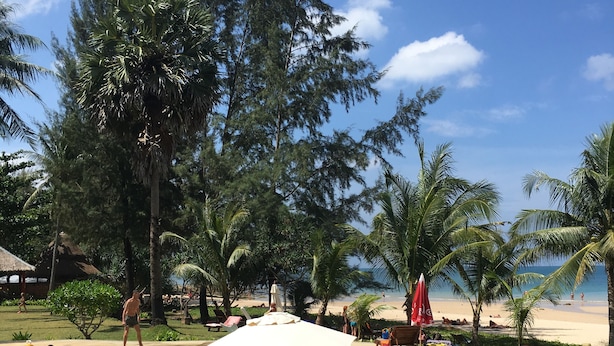 A pool area with a sign instructing to take a shower before swimming. - Good Days Lanta Beach Resort (Ko Lanta)