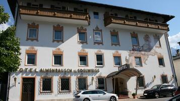 A hotel with a classic facade, multiple windows, and a prominent entrance.