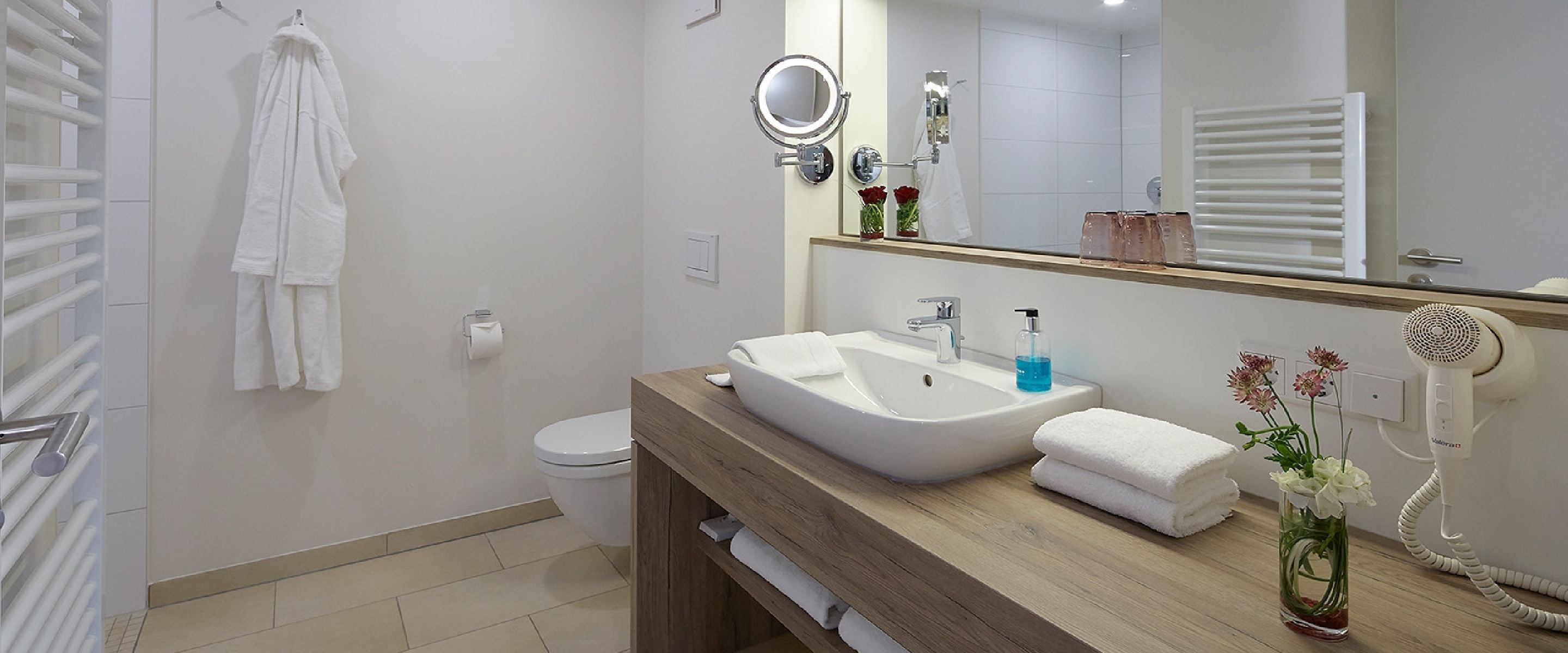 shower, hair dryer, heated floors, towels