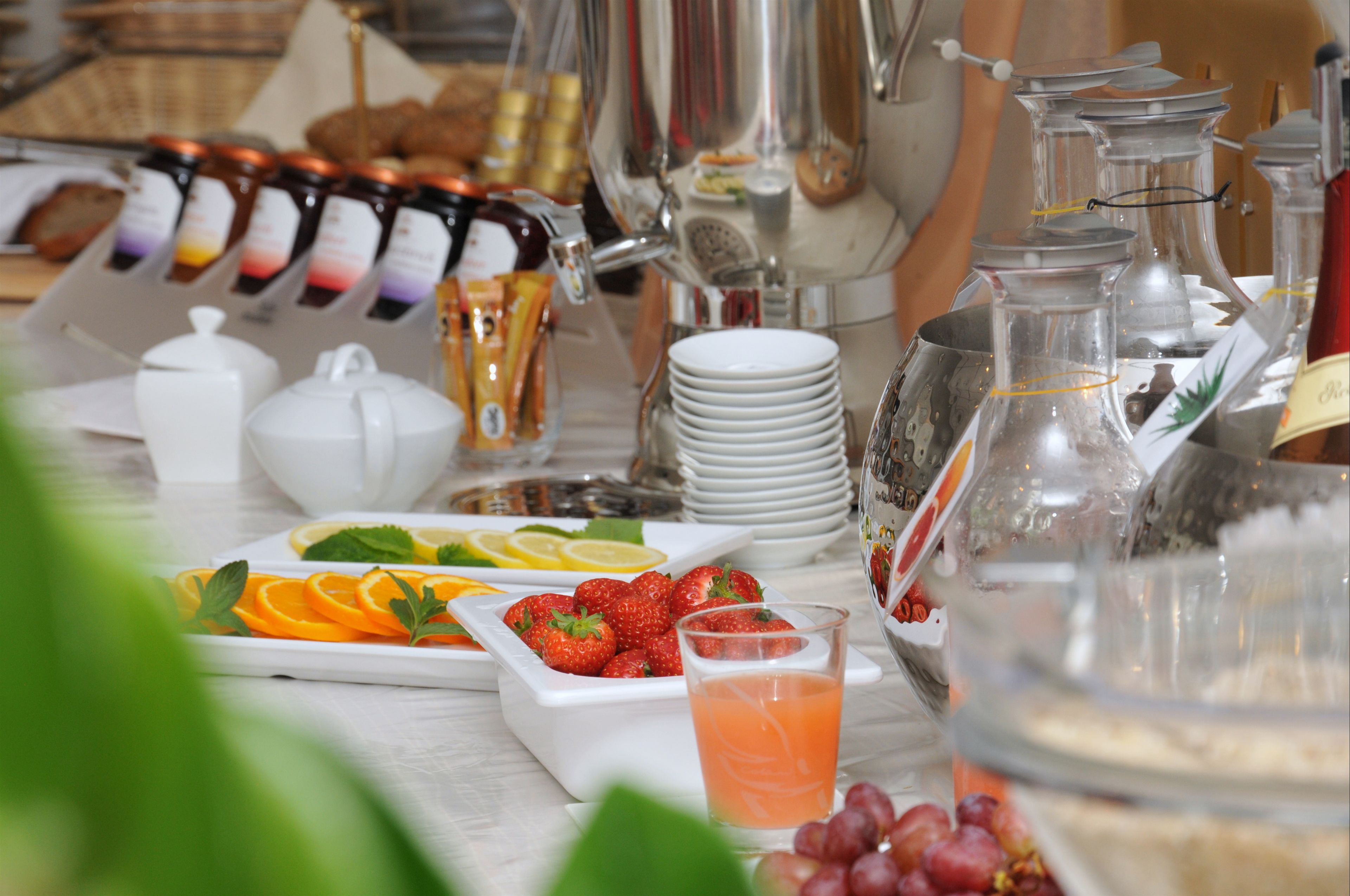 A breakfast buffet with various food items and beverages.