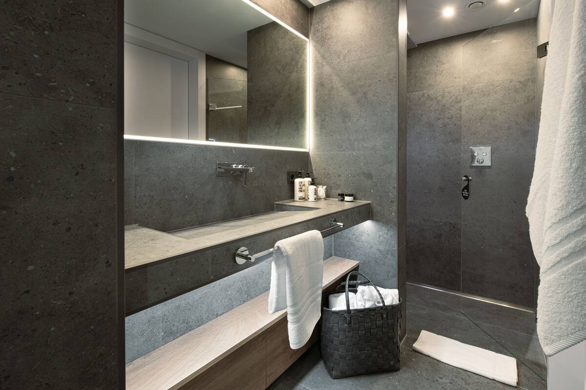 design double room | bathroom | rainfall showerhead, eco-friendly toiletries, hair dryer, bathrobes