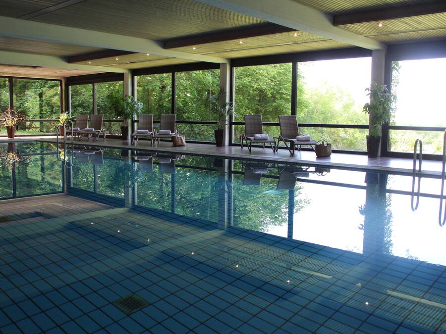 Indoor pool, open 7 AM to 11 PM, sun loungers