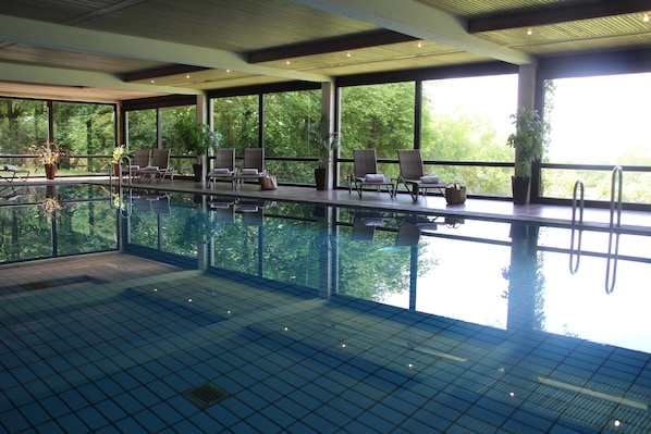 Indoor pool, open 7 AM to 11 PM, sun loungers