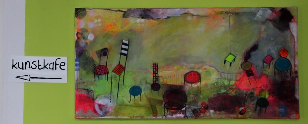 A colorful abstract painting with a label pointing to it.