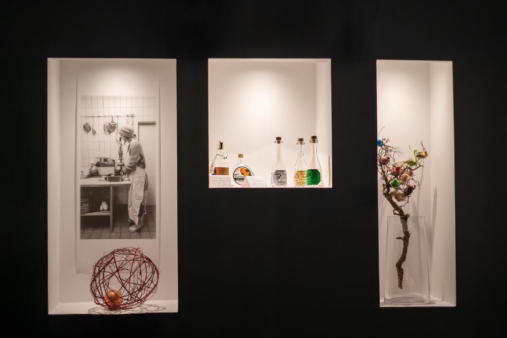 Three framed artworks on a wall.