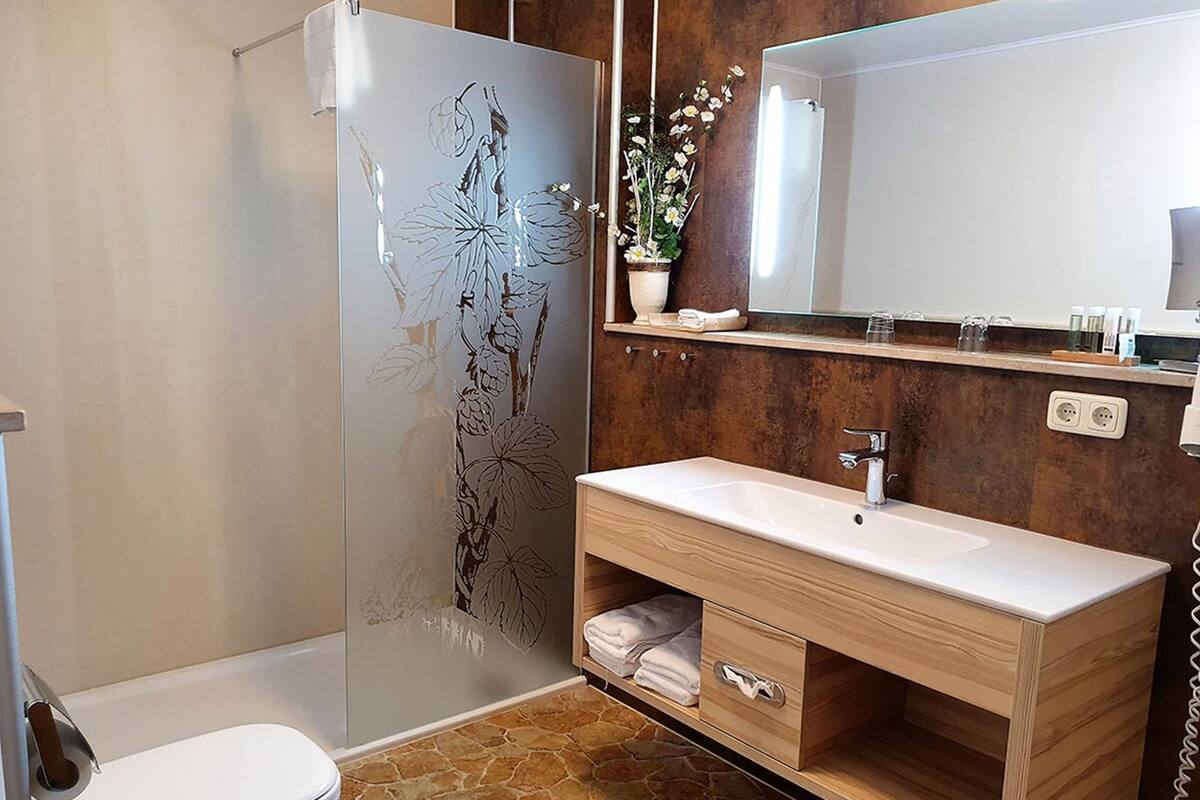 comfort suite, 1 king bed | bathroom | shower, free toiletries, hair dryer, towels