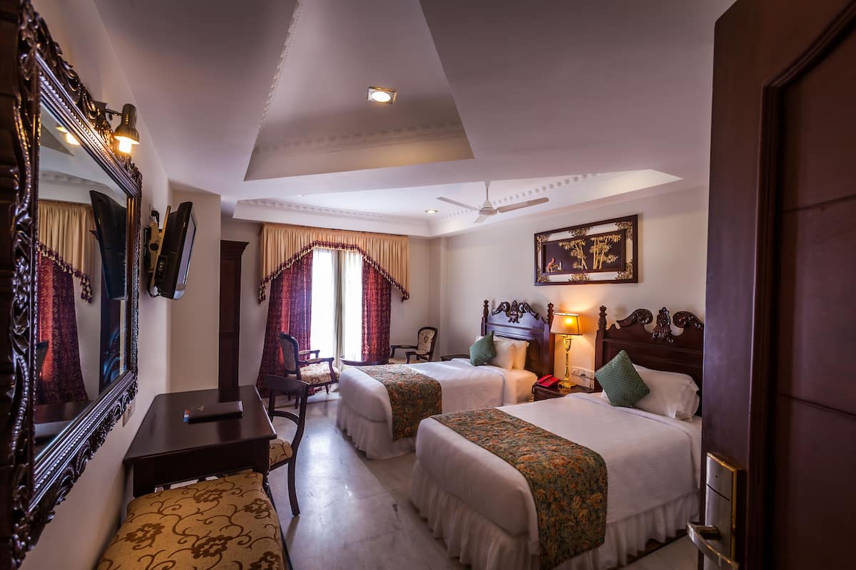 Executive Suite, Pool View | 1 bedroom, premium bedding, minibar, in-room safe