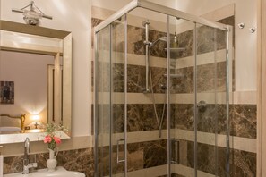 Apartment | Bathroom | Shower, rainfall showerhead, designer toiletries, hair dryer