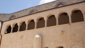 A building with multiple arches and columns, suggesting a historical or architectural significance. - Giogaia Bed & Breakfast (Modica)