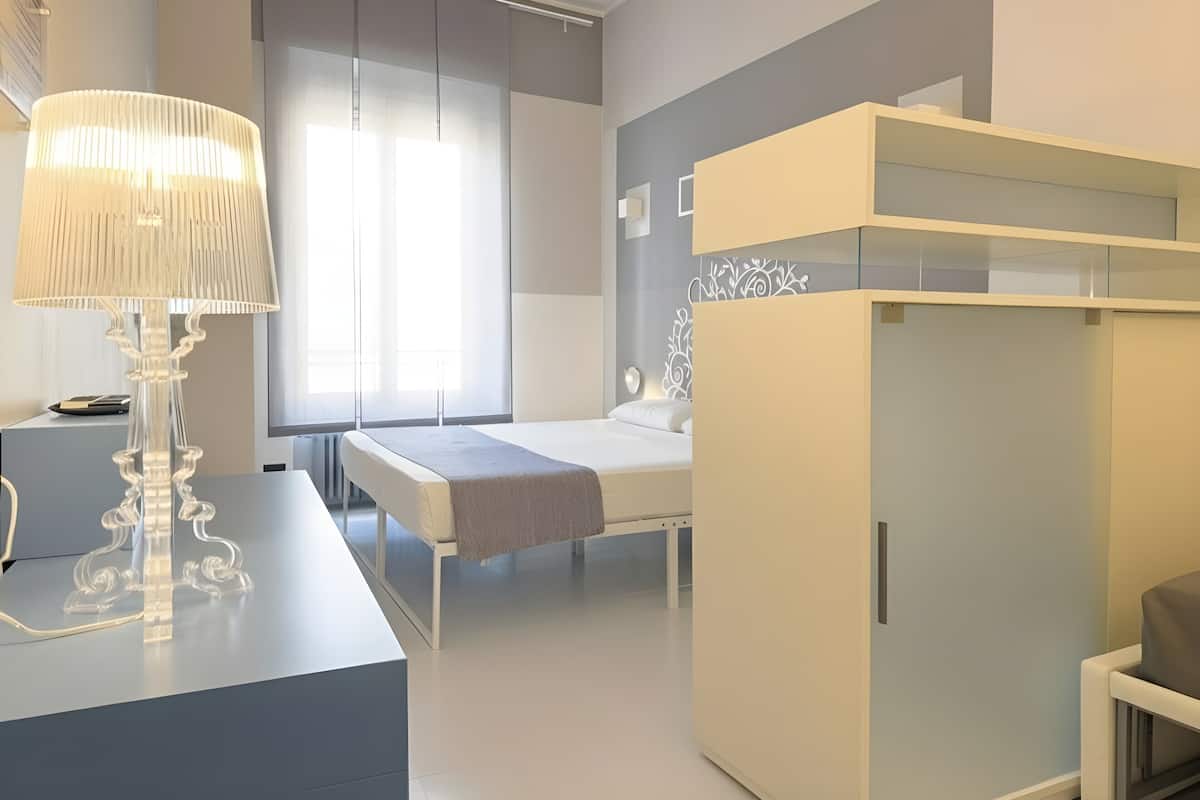 Standard Quadruple Room | Minibar, in-room safe, desk, blackout curtains