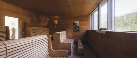 A wooden interior with benches and a window.