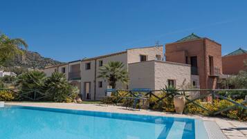 Indoor pool, seasonal outdoor pool, pool umbrellas, pool loungers