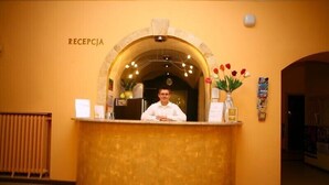 A reception desk with a sign reading "RECEPCJA" above it. - Hotel EUROPA (Jelenia Gora)