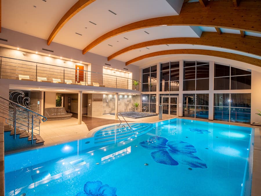 Indoor pool, open 9:00 AM to 9:00 PM, pool loungers, lifeguards on site