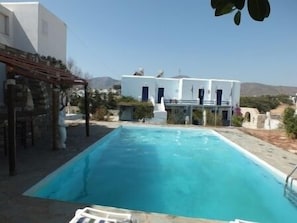 Outdoor pool, pool umbrellas, sun loungers