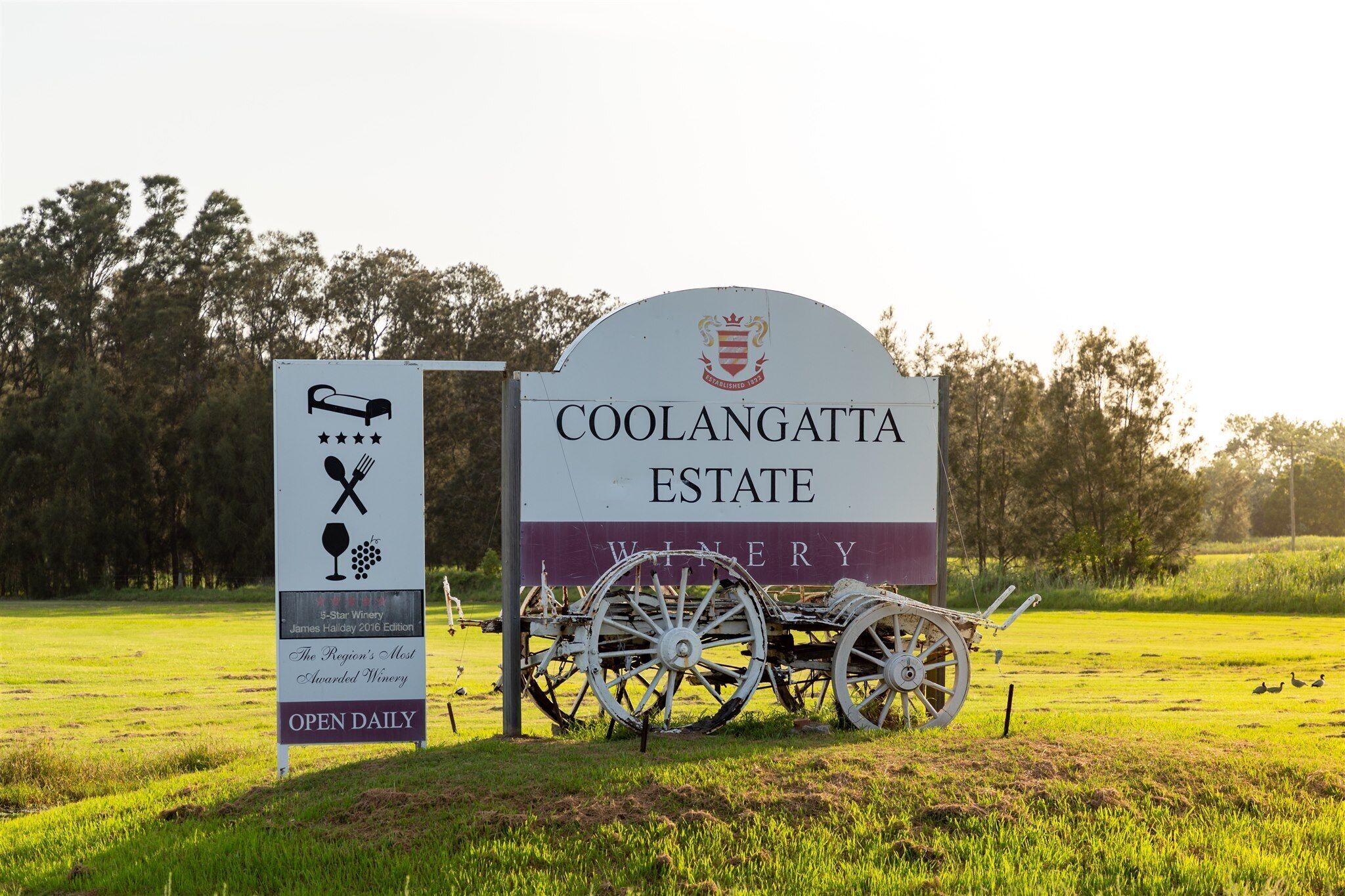 A sign for Coolangatta Estate Winery with a bed symbol, indicating accommodation.