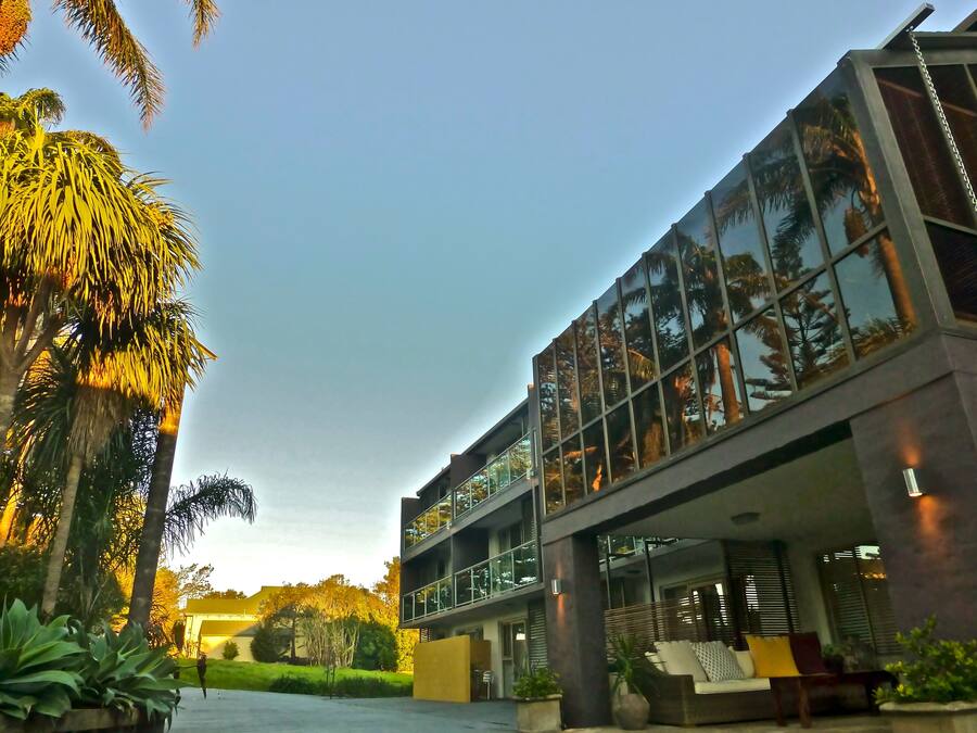 A modern building with large glass windows and a flat roof.