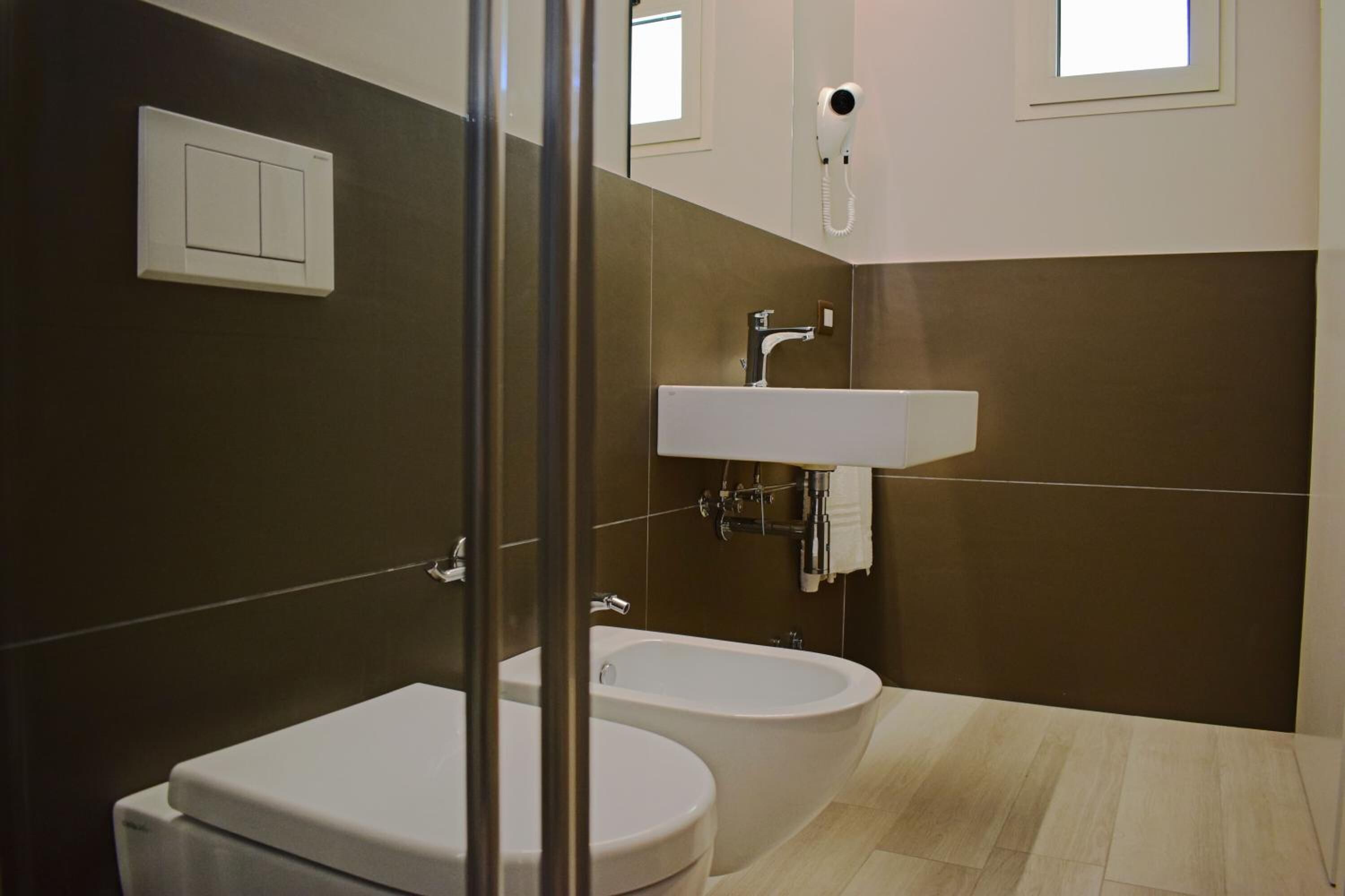 shower, hair dryer, slippers, bidet