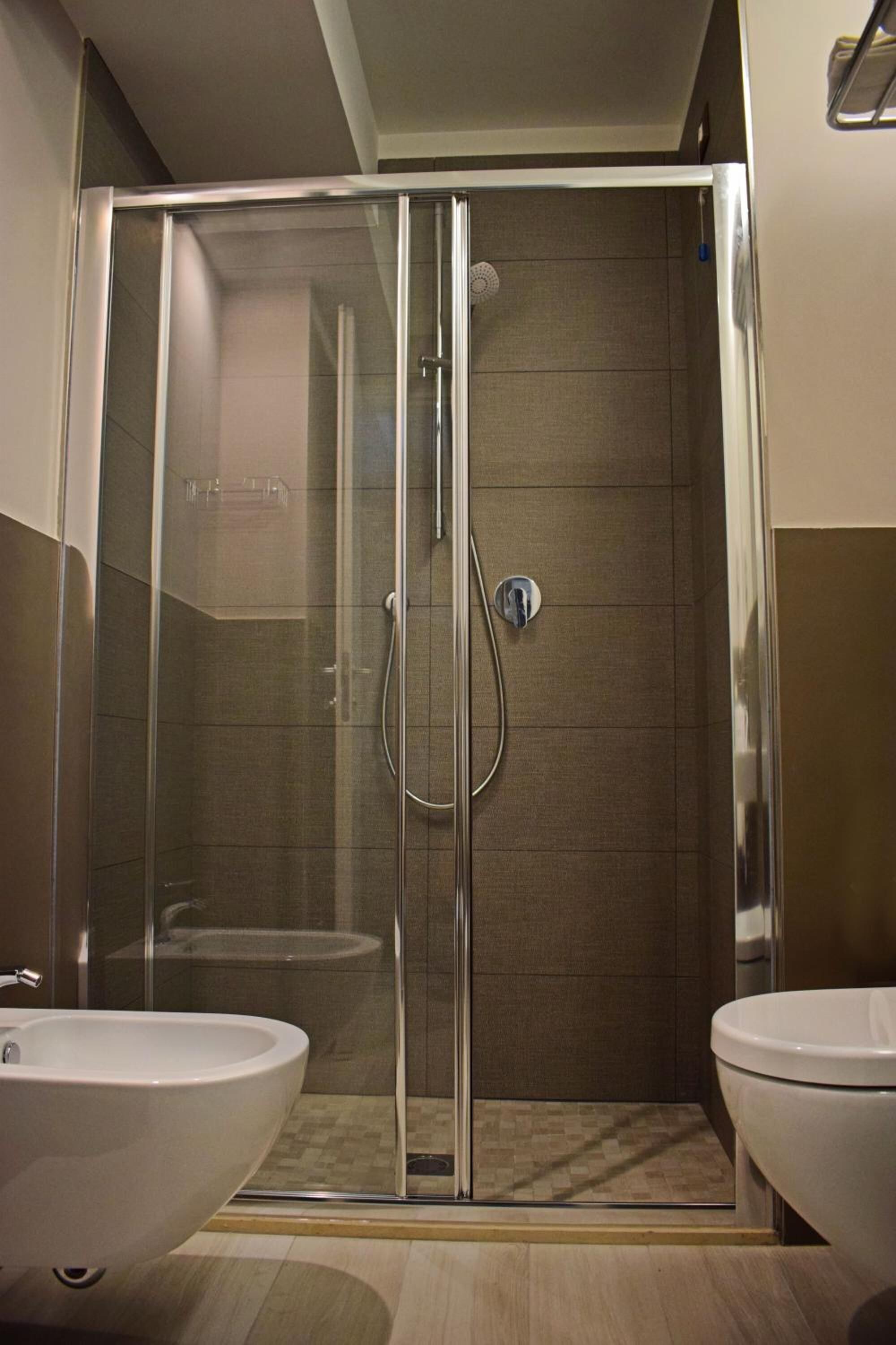 shower, hair dryer, slippers, bidet