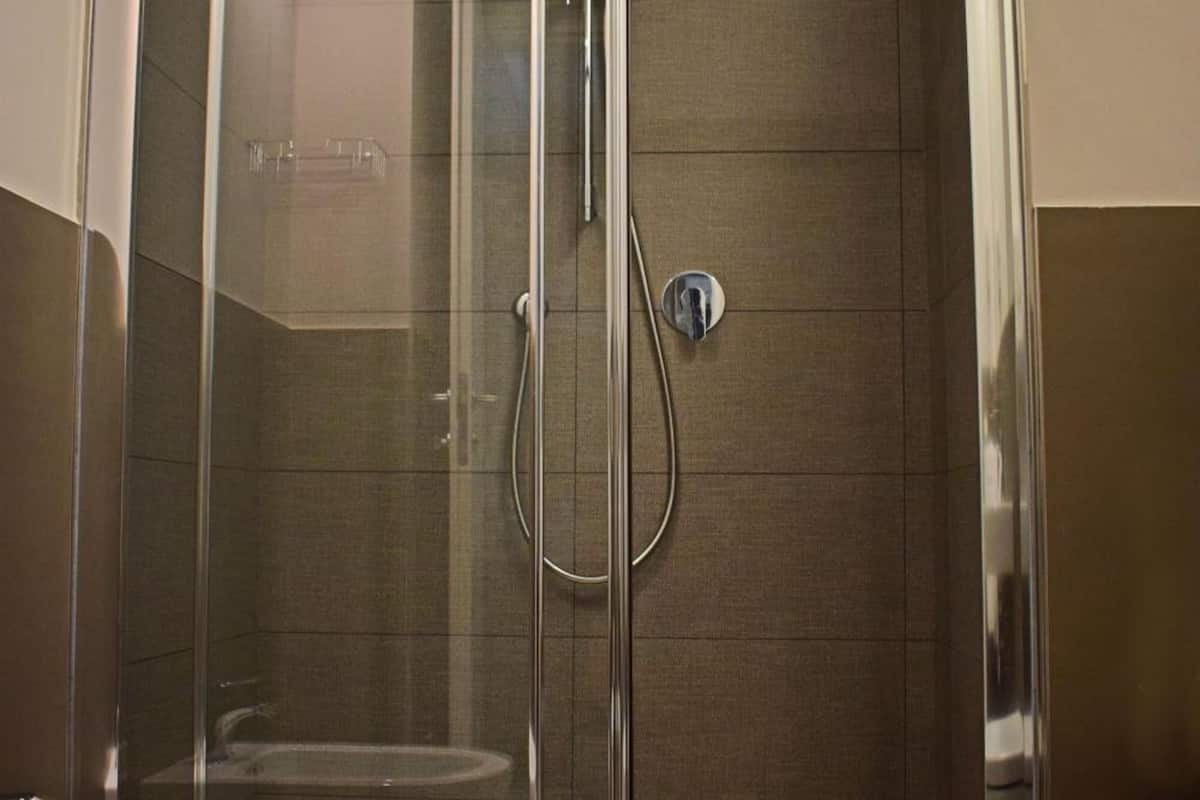 shower, hair dryer, slippers, bidet