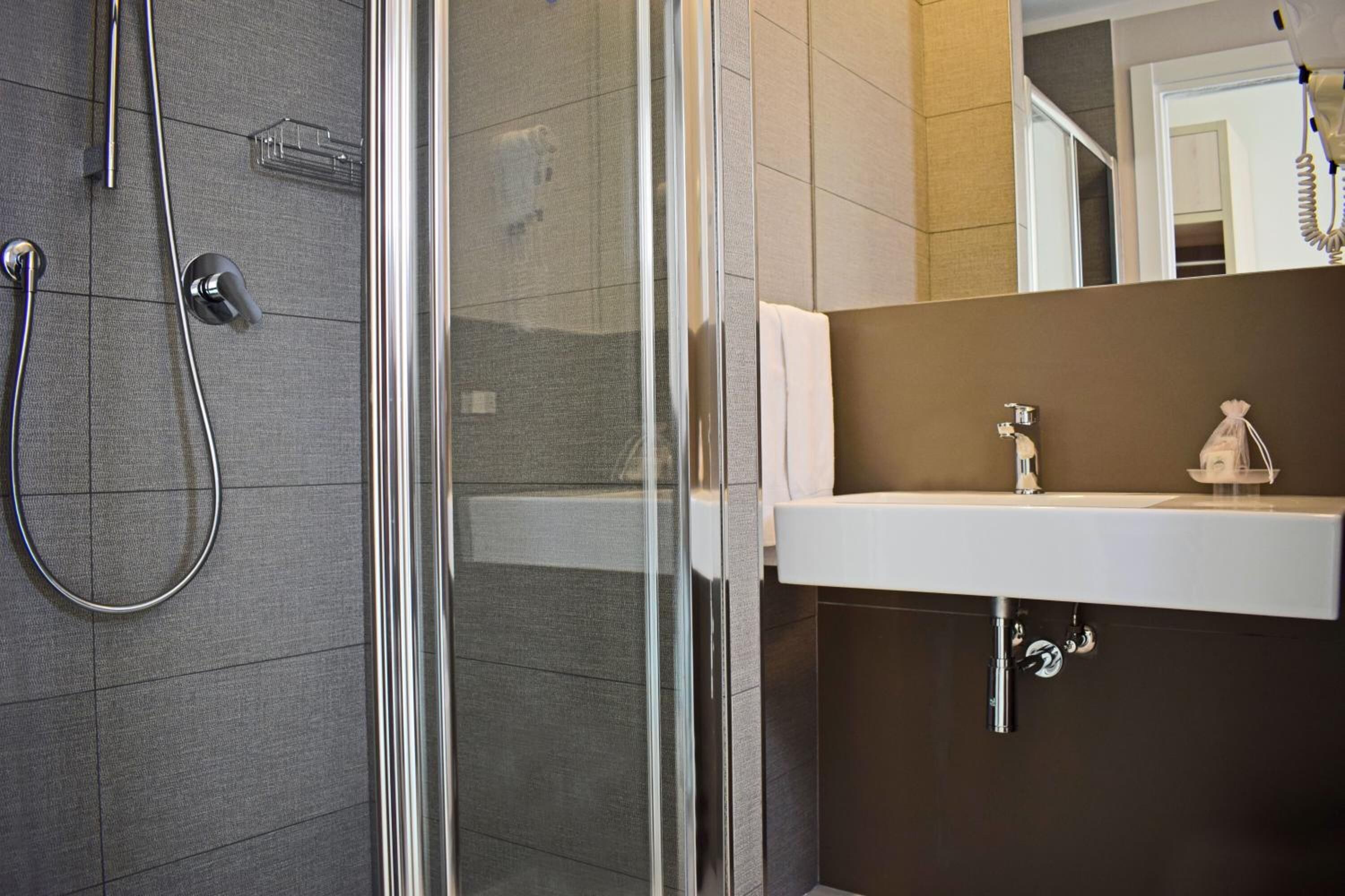 shower, hair dryer, slippers, bidet