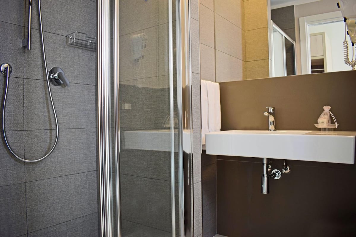 shower, hair dryer, slippers, bidet