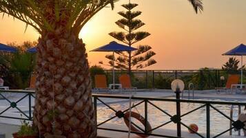 Indoor pool, outdoor pool, pool umbrellas, sun loungers