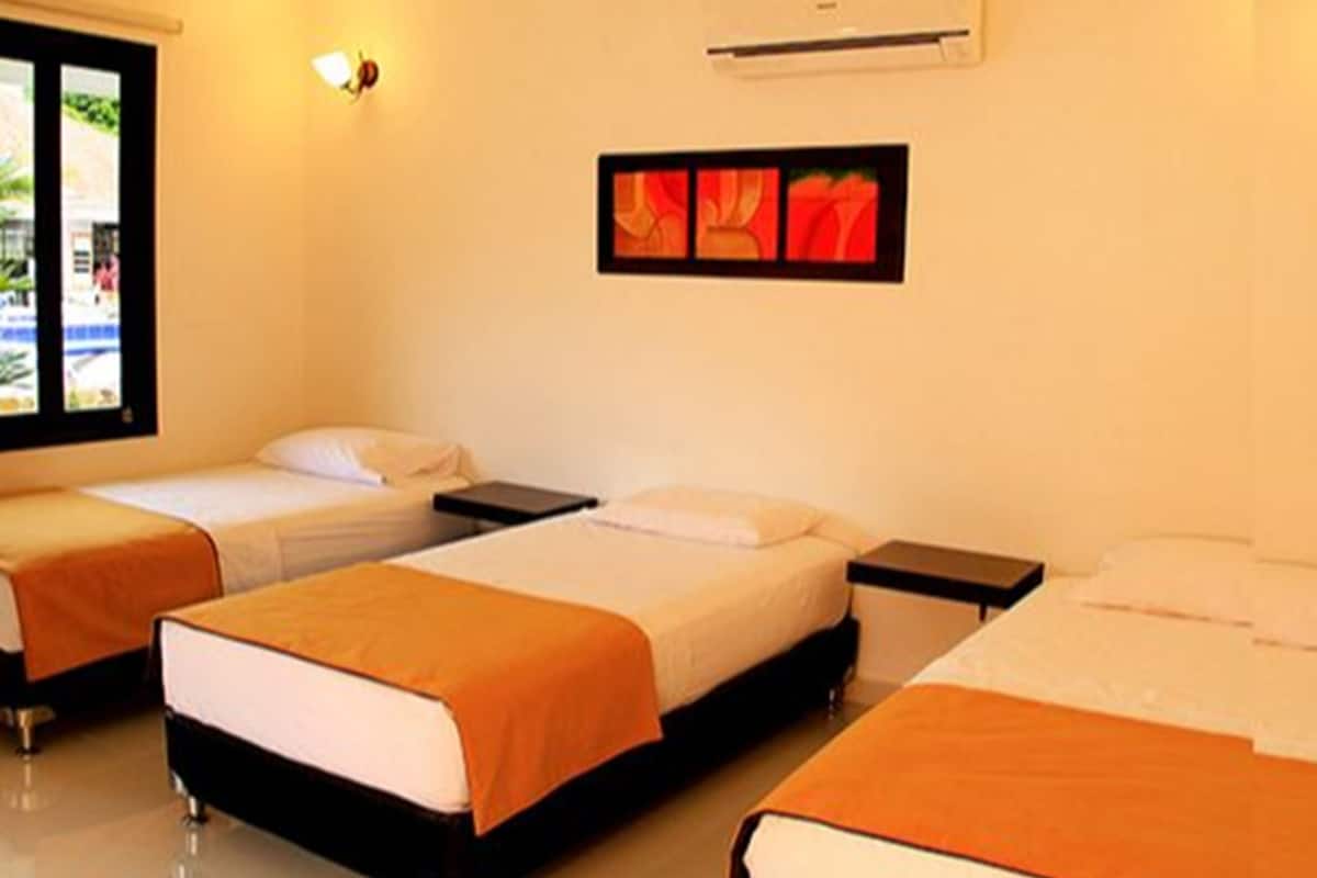 Standard Triple Room | Premium bedding, minibar, in-room safe, individually decorated