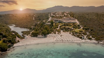 Relax on the beach with stunning views of lush surroundings.