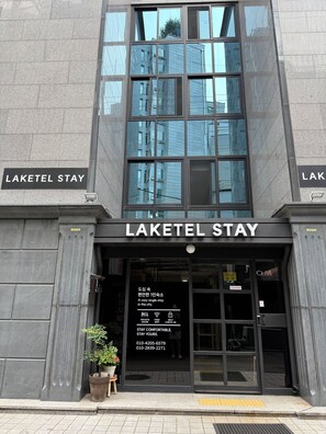 The exterior of Laketel Stay, a modern building with large windows and a clear entrance. - Laketel (Seoul)