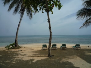 On the beach, sun loungers