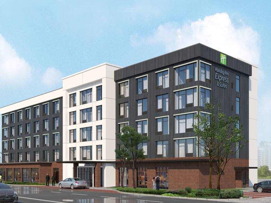 A Holiday Inn Express building with a modern design, featuring multiple floors and large windows.