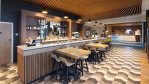 A modern bar area with a long counter, multiple seating options, and a patterned floor. - Holiday Inn Paris CDG Airport by IHG (Roissy-en-France)